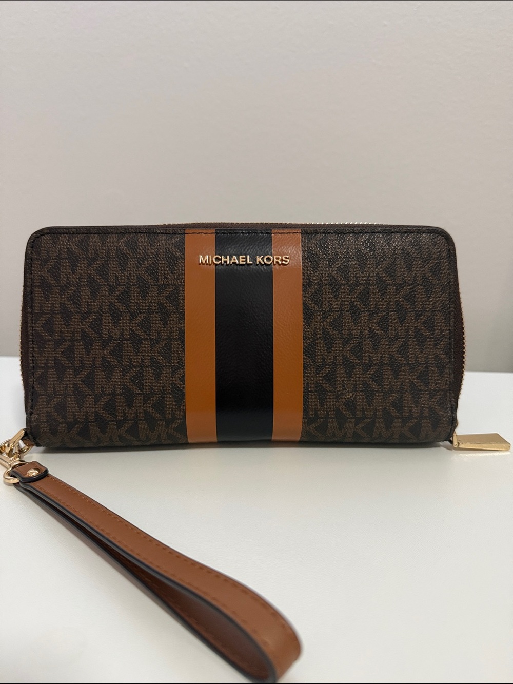 Michael Kors Brown Logo Wristlet with Tan and Black Center Stripe